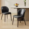 Two-piece dining chair set upholstered seats wooden legs ergonomic design 265 lbs weight capacity suitable for dining rooms.
