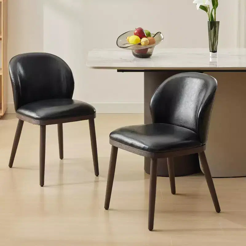 Two-piece dining chair set upholstered seats wooden legs ergonomic design 265 lbs weight capacity suitable for dining rooms.